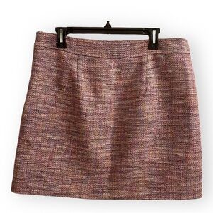 Loft size 12 pink tweed skirt with accents of orange and blue.
